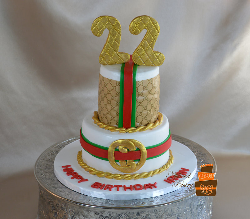 Gucci cake with matching belt and wallet. Made with Cake Couture fondant.