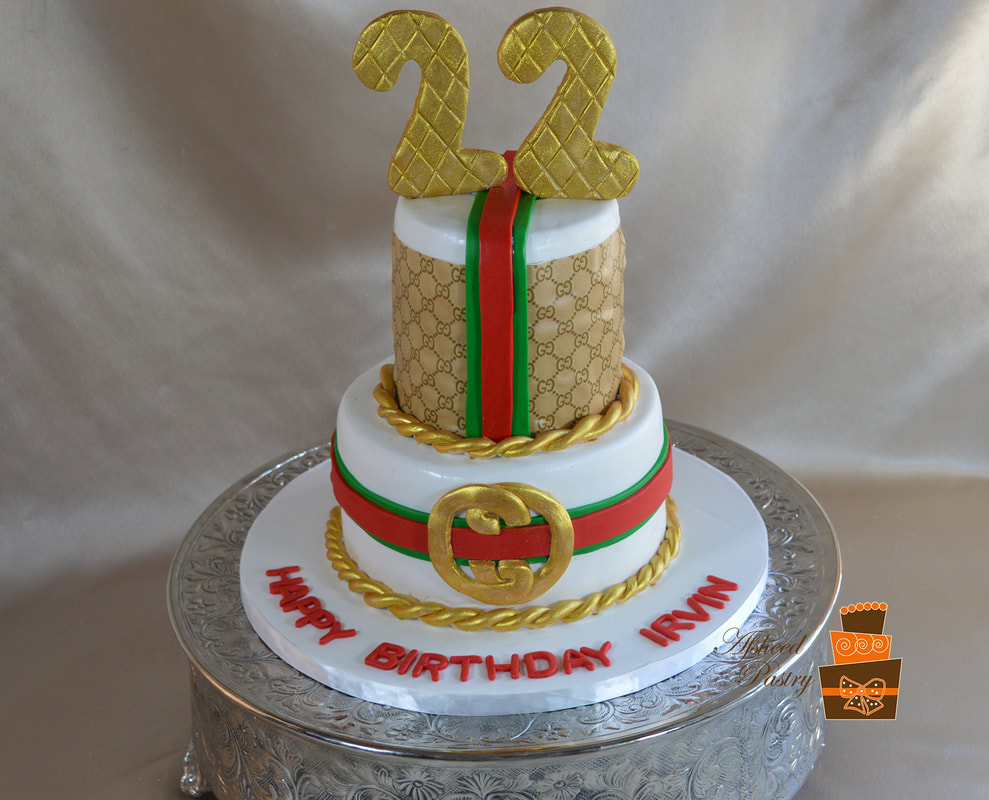 Masters Cakes - 2 tier Gucci Cake Fault-line CakeHappy